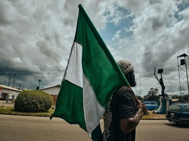 Man holding Nigeria flag