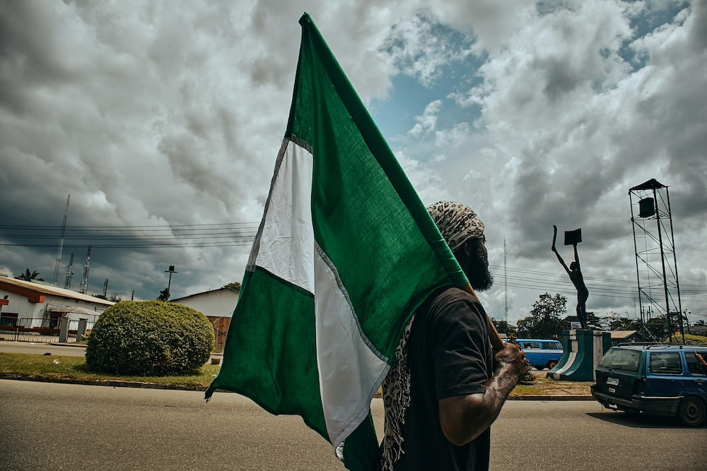 Man holding Nigeria flag